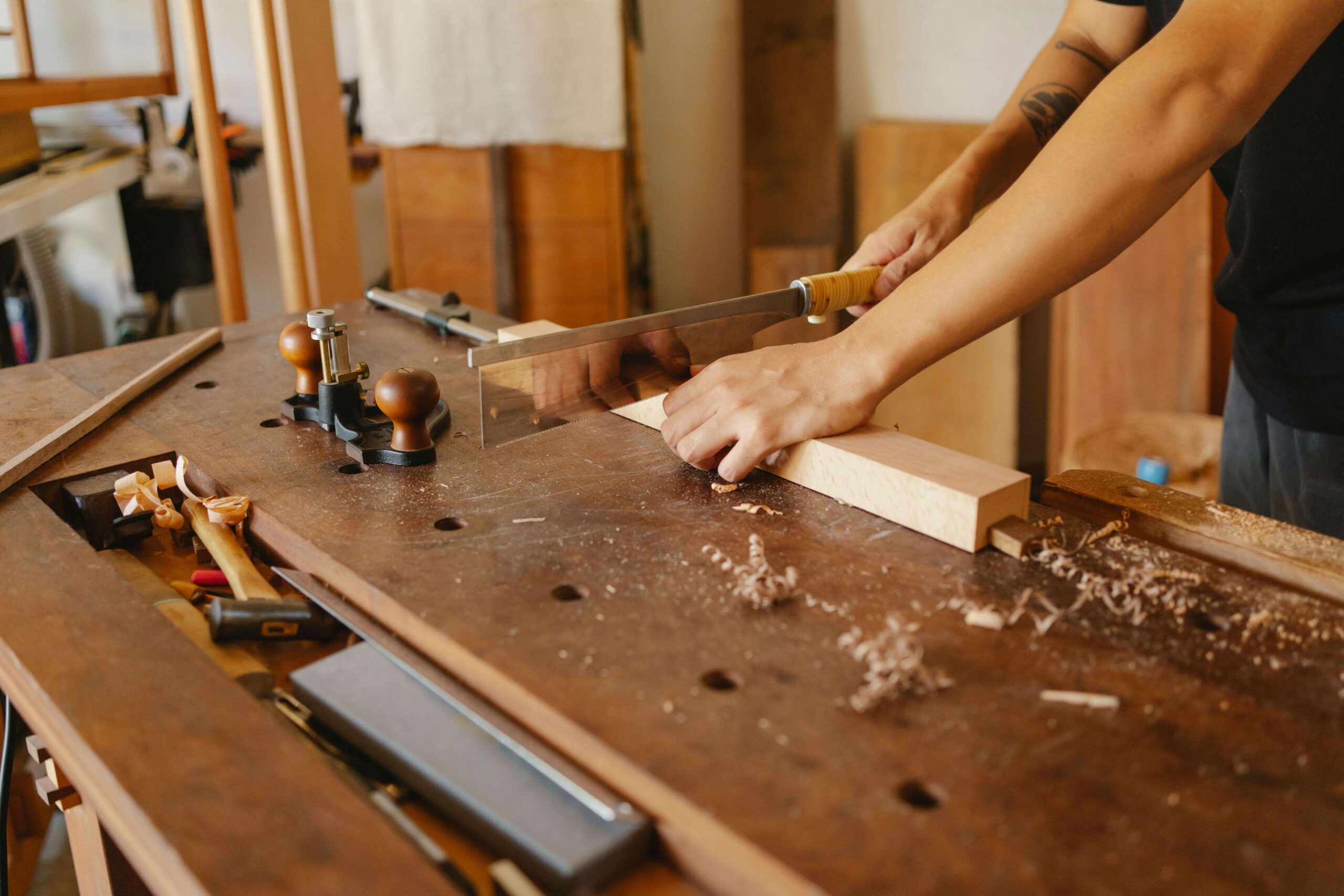 A Carpenter Sawing Wood